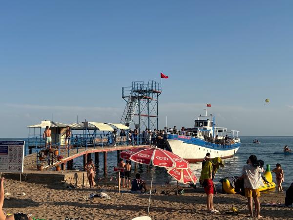 Tour boat and dive platform at Cholpon Ata Public Beach