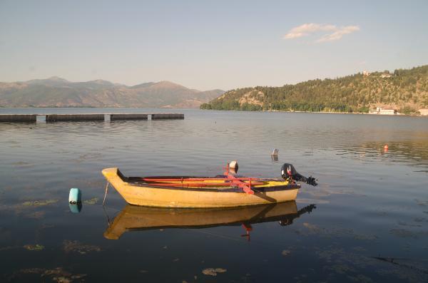 boat on orestiada lake shore in kastoria city