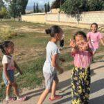 friendly little girls in kyzart village of kyrgyzstan