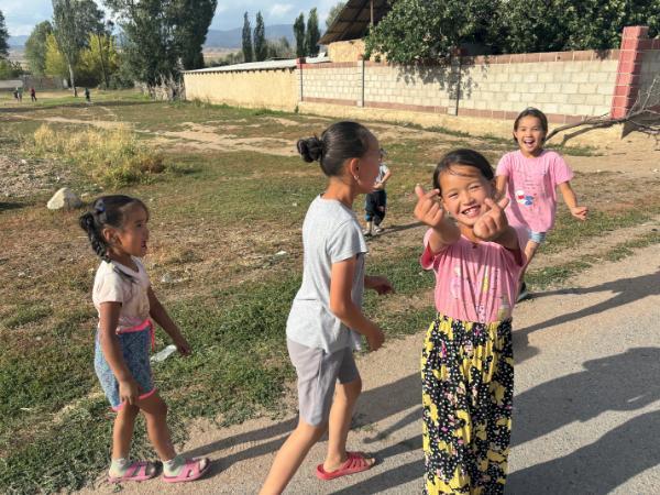 friendly little girls in kyzart village of kyrgyzstan