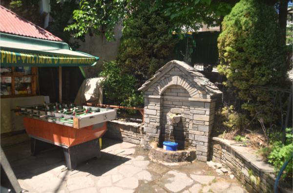 stone Spring next to kiosk in square of samarina village in northern greece