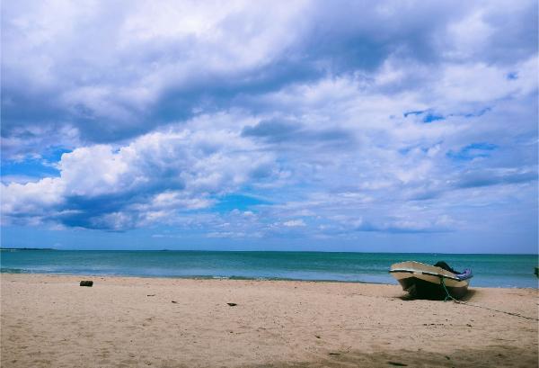 Lone boat at Nilaveli beach in sri lanka