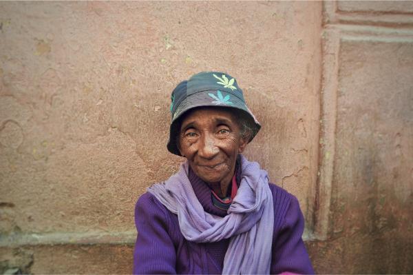 Begging kind old lady with ganja hat in the streets of antananarivo