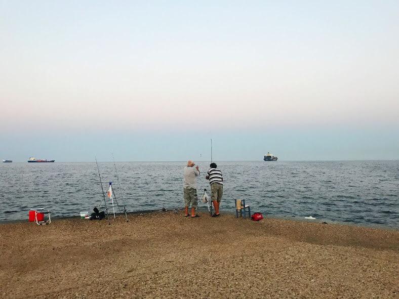 old men fishing at esplanade of thessaloniki, greece