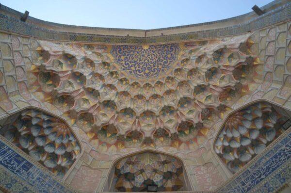 Elaborate vaulted iwan of Abdulaziz Khan Madrasah