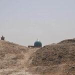 Distant turquoise mosque dome viewed from atop the fort of Bukhara