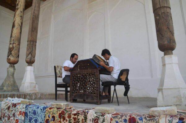 Artisans decorating bronze plates in ark citadel of bukhara