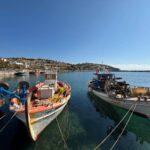 photo of fishing boats in the little port of agioi apostoloi village on euboea island, greece