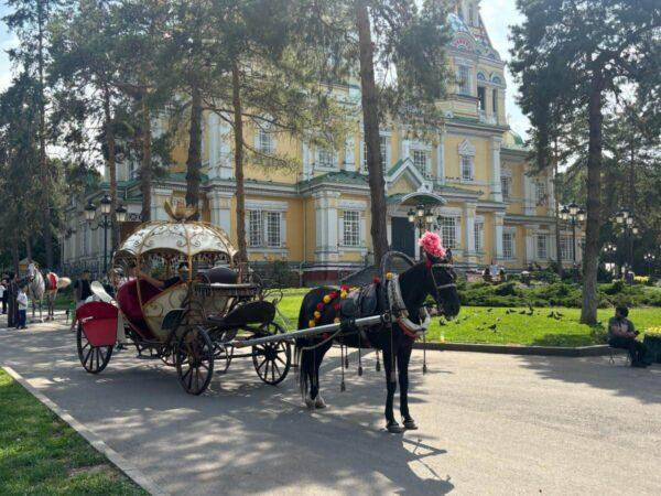 Cinderella’s coach in front of the Ascension Cathedral in almaty