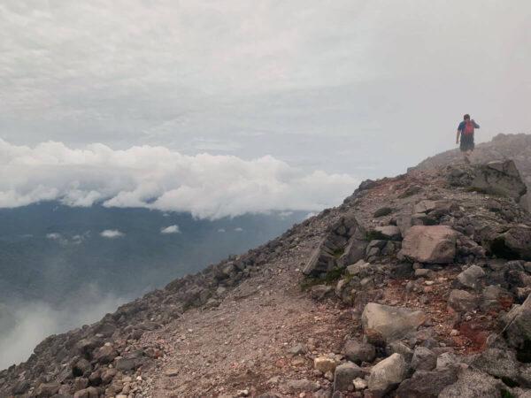 Walking around the crater rim of arenal volcano