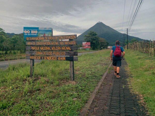 walking toward arenal volcano in costa rica at dawn