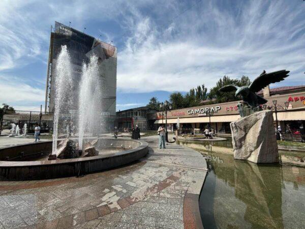 tsum square with fountains and eagle statue in bishkek