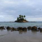 photo of agios nikolaos islet off the beach of ellinikia village on euboea island, greece