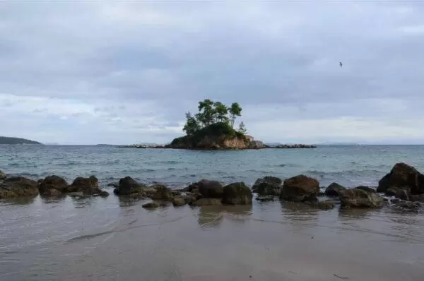 photo of agios nikolaos islet off the beach of ellinikia village on euboea island, greece