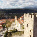 aerial photo of medieval tower and church in avlonari, euboea, greece