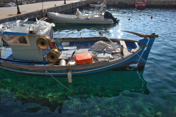 Fishing boat in small port on evia island