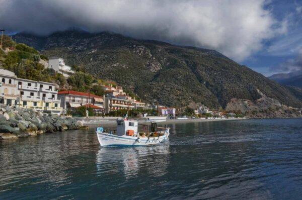 Fishing boat entering the port of Ilia, evia island