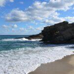 splashing waves at kalamos beach, evia island, greece