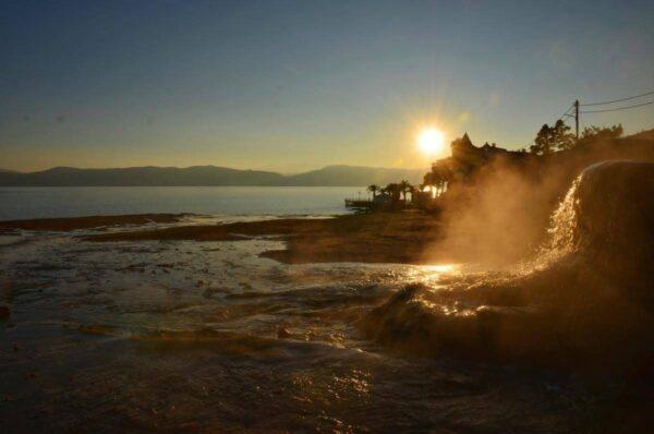 Steaming springs at sunset in loutra edipsou, evia island, greece