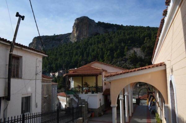 The Church Virgin Mary’s Assumption below imposing cliffs in steni village, evia island