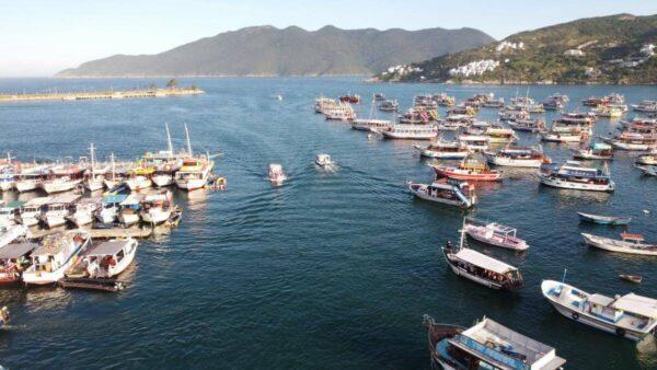 aerial photo of cluttered tour boats bay of arraial do cabo in brazil