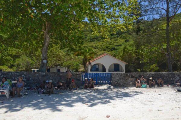 shaded area in front of a cute beach house in praia do forno