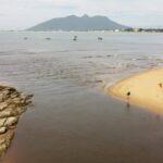 view of mountain after river mouth and sea in rio das ostras, brazil