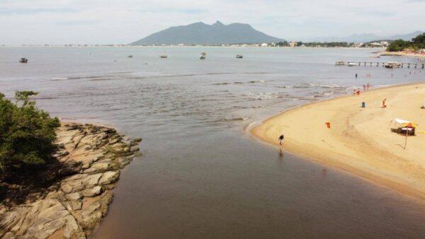 view of mountain after river mouth and sea in rio das ostras, brazil